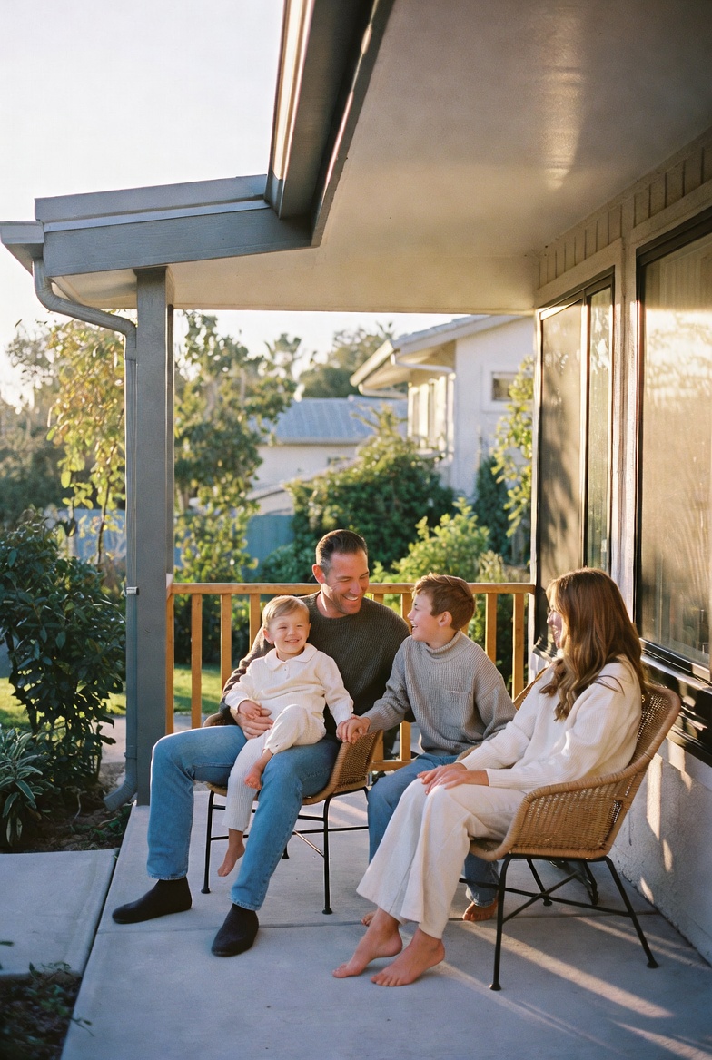 Family on the porch of a solar-powered home